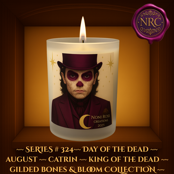 Series #324 August Day of the Dead Catrin Candle featuring skeletal face with maroon sugar skull swirls, deep burgundy suit, and golden stars by Noni Ross Creations